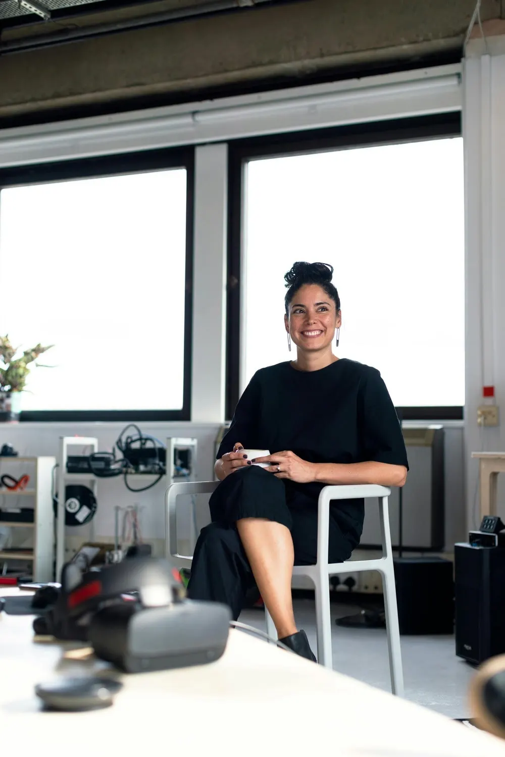 A woman smiling sitting in the office
